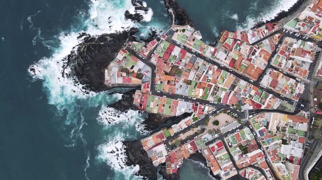 A second close aerial view shifts the angle slightly on the same dense street pattern of Punta Brava. Companion coverage from the same low altitude Tenerife pass.