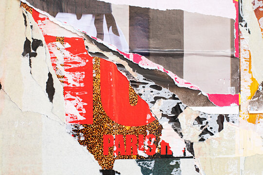 Abstract close-up of a textured paper  and torn posters with fragmented dark shapes and red pink detail
