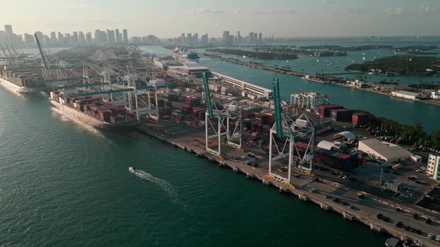 Miami, Florida, USA - March 28, 2025: Freight container of cargo. Port of Miami. Container loading. Export and import. Cargo business. Cargo services with container in Miami port, 4k