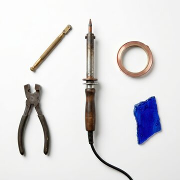 Glass artist tools and supplies arranged on a work surface