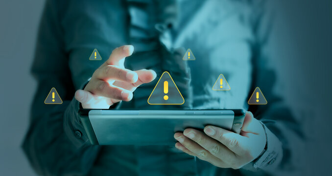 Security alert concept for smartphones cybersecurity protection, fraud prevention, threat monitoring, data security, and alerts for suspicious activity. An executive working on risk management.