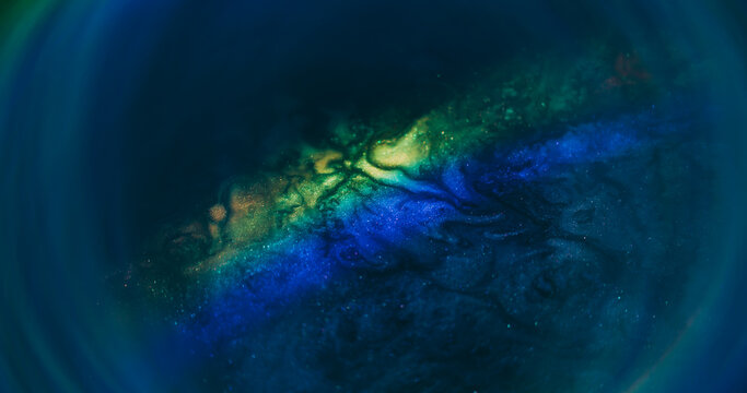 Spectrum flare. Blur colorful paint. Shimmering gray pigment stream blend rainbow neon light dye. Blue green abstract background.
