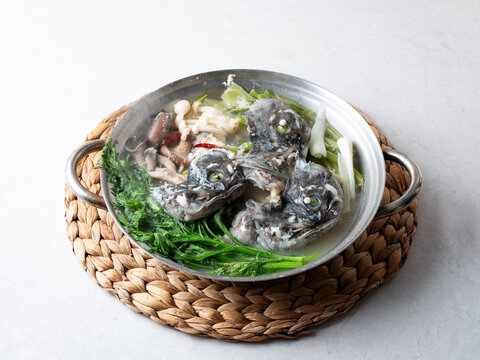 Korean spicy fish stew known as Ureok-maeuntang with raw rockfish chunks and assorted mushrooms