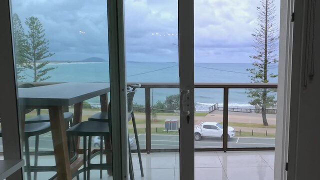 Camera Moving from Modern Balcony Interior Toward Ocean View