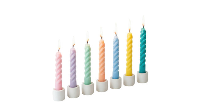 Row of seven colorful spiral taper candles in small white ceramic holders isolated on transparent background