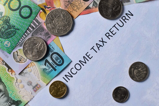 Bank notes & coins  on top of tax return