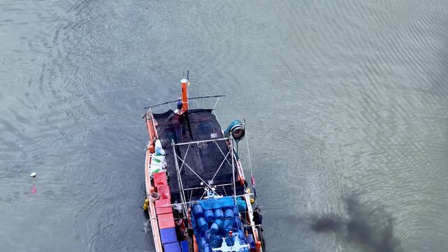 Aerial Overhead View of Fishing Trawler Boat Navigating Coastal Waters