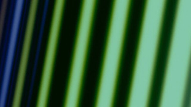 Abstract background with blurred green diagonal lines and grainy texture