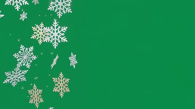 White snowflakes on green screen background.