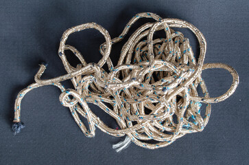 Knot of decorative rope on a black background © Володимир Виповський