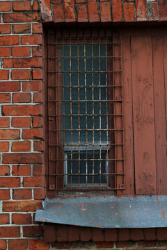 old window with metal grid