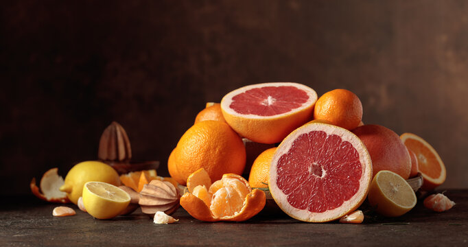 Citrus fruits on a old brown table.