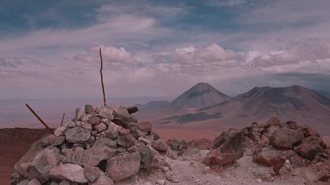 Stone Summit Marker on Cerro Toco Overlooking Licancabur Volcano in the Atacama Desert, Chile   