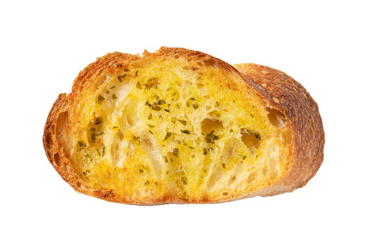Single slice of toasted garlic bread with herbs top view isolated on transparent background