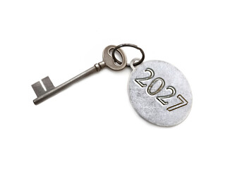 2023 engraved on a ring of an old key isolated on white background © coco