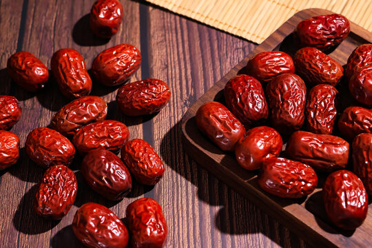 Dried Red Jujubes on Wooden Tray and Table
