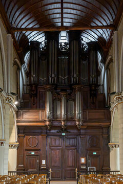 Verneuil-sur-Avre, France - 10 09 2026: Church of the Madeleine. Panoramic view of the main entrance portal and the pipe organ above it