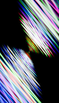 Abstract colorful light streaks with dynamic motion on dark background