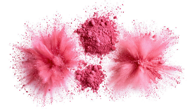 Collection of pink makeup powders in explosive arrangements on a white studio surface