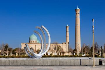 Hazrati Imam Mosque with turquoise dome and brick minarets viewed from a modern plaza in Tashkent, Uzbekistan. Ideal for travel publications, cultural guides, and architectural features. © finepoints
