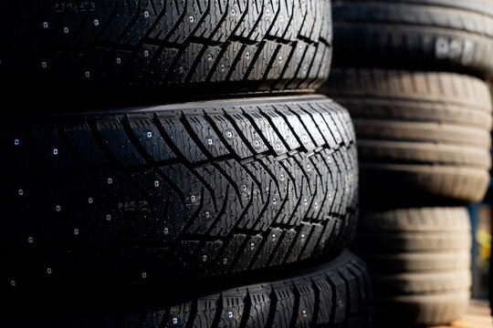 Stacked Studded Winter Car Tires with Detailed Tread Pattern