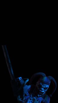 Creepy seamless vertical video of an horror clown with a chainsaw and color strobe lights. Halloween background of a terror character isolated with copy space