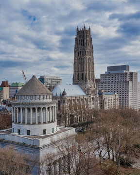 New York, United States - 02 April 2021: Aerial view of General Grant National Memorial and Riverside Church in Riverside Park with the Manhattan skyline under a cloudy sky.