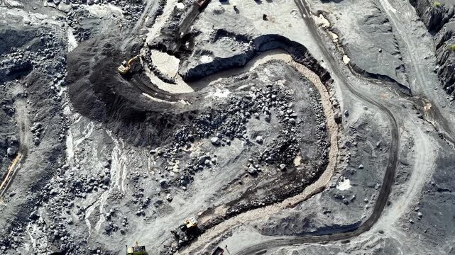 High angle drone shot showing lahar cleanup operations at Mount Semeru in Lumajang, Indonesia.