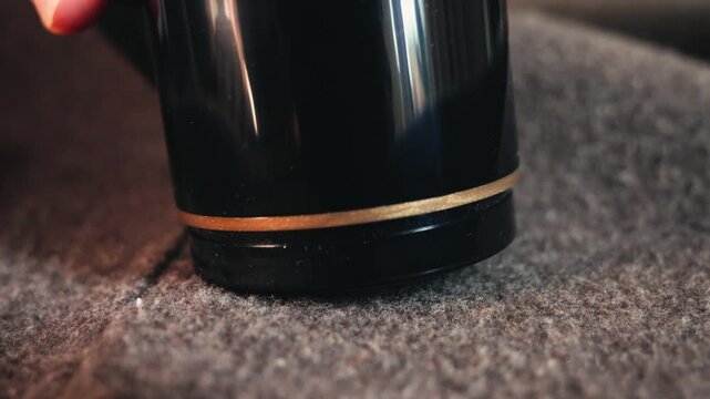 Close up of lint remover shaving fabric removing lint and fuzz from clothes, garment care and cleaning concept. High quality 4k footage