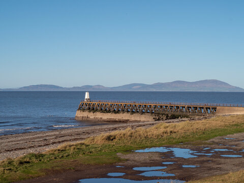 Maryport Pier and view of Criffel Mountain from Maryport, Cumbria, England