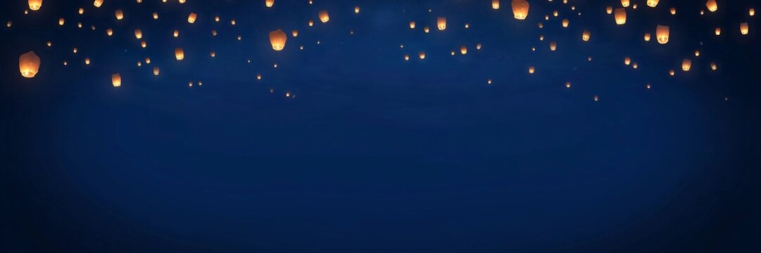 Sky Lanterns in a Deep Blue Night Sky - Celebration Background with Copy Space