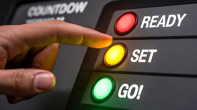Finger pressing a countdown control panel with ready set go indicator lights representing preparation and action