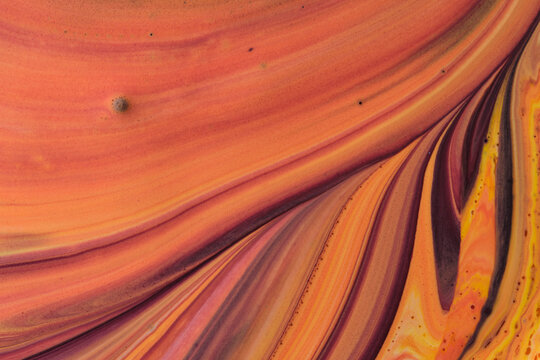 Abstract liquid acrylic texture featuring peach orange tones with dark plum diagonal fluid lines.