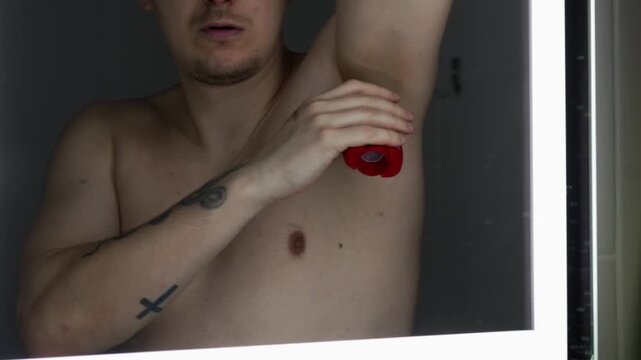 Use of underarm deodorant by a young man.
Protection against sweating.