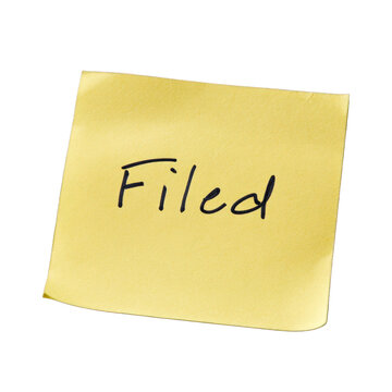 Filed handwritten in dark ink on a yellow sticky note with lightly textured paper, isolated on transparent background