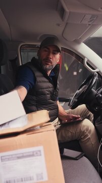 Male courier delivering a package.