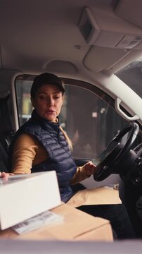 Female courier delivering a package.