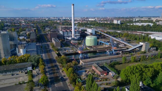 Gas power plant infrastructure, industrial cityscape. Smooth aerial view drone