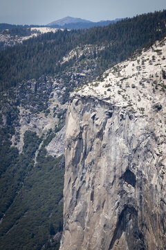 Massive granite cliff of El Capitan seen from Sentinel Dome trail in Yosemite