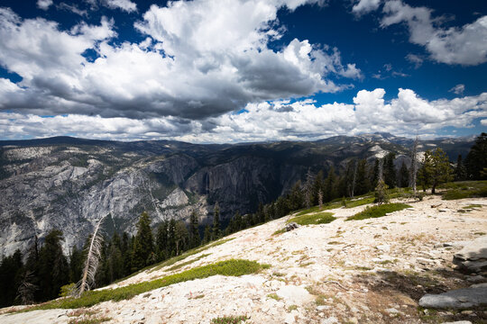 Scenic panorama of Yosemite Valley mountains and pine trees from Sentinel Dome Trail