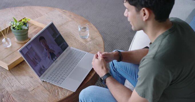 African American man noticing doctor on laptop screen for telehealth, leaning, fidgeting