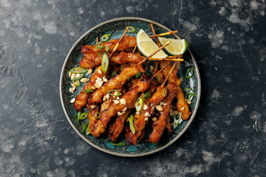 Grilled Chicken Satay Skewers with Peanuts, Spring Onions and Lime