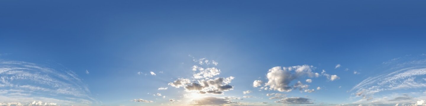 360 hdri blue sky with beautiful clouds with halo like a seamless panorama view with zenith for use in 3d graphics or game development as sky dome or edit drone shot
