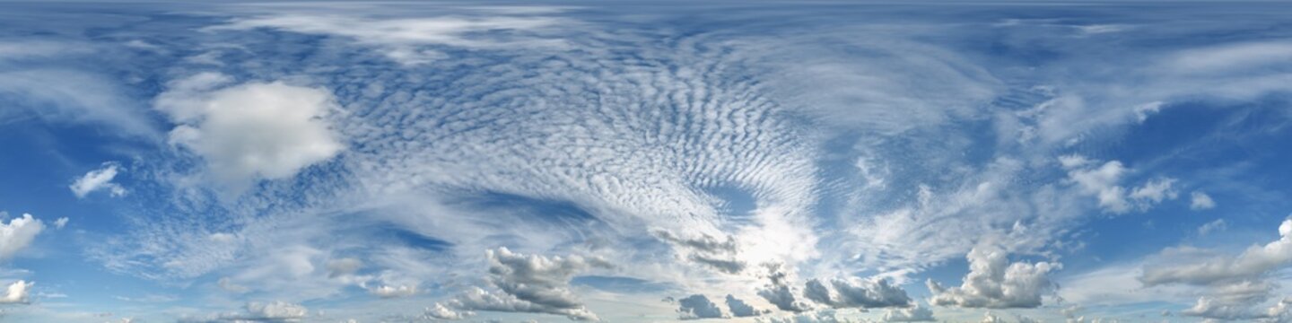 360 hdri blue sky with beautiful clouds with halo like a seamless panorama view with zenith for use in 3d graphics or game development as sky dome or edit drone shot