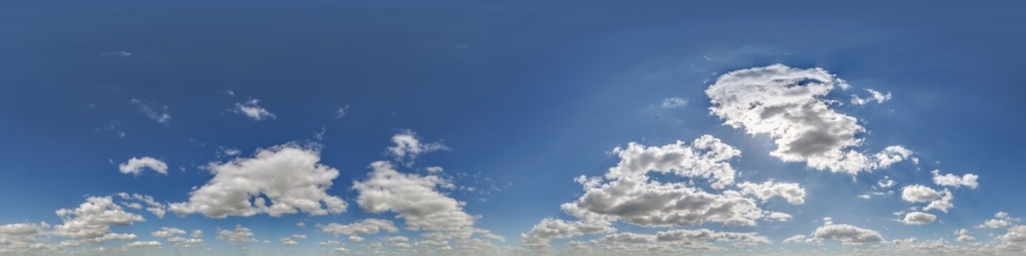 360 hdri blue sky with beautiful clouds with halo like a seamless panorama view with zenith for use in 3d graphics or game development as sky dome or edit drone shot