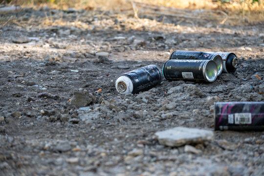 Discarded Spray Paint Cans After Graffiti