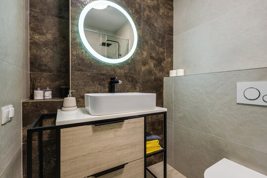  details of corner with water tap sink with faucet with soap and shampoo dispensers in expensive bathroom in rustic eco style