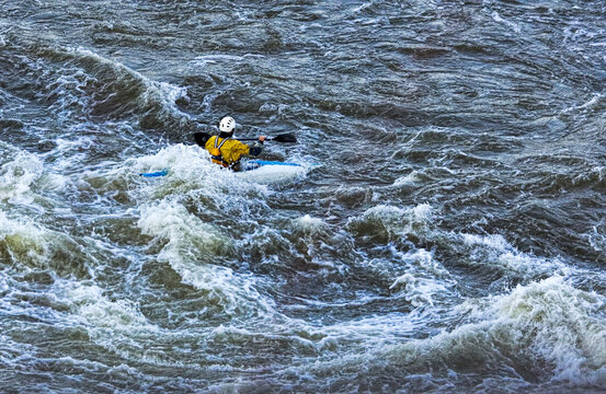 Paddler in Rough Water Below Falls