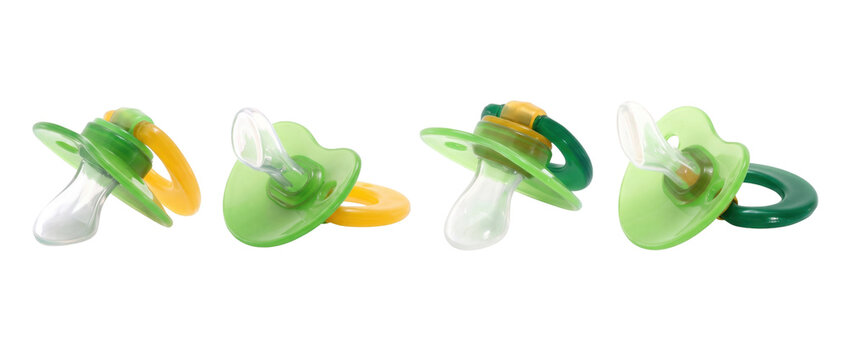 Green baby pacifiers, set of 4 silicone infant soothers isolated on Transparent Background