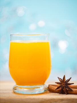 Orange juice punch, hot winter drink with fresh fruit, cinnamon and star anise spice, christmas season, citrus bererage, healthy breakfast